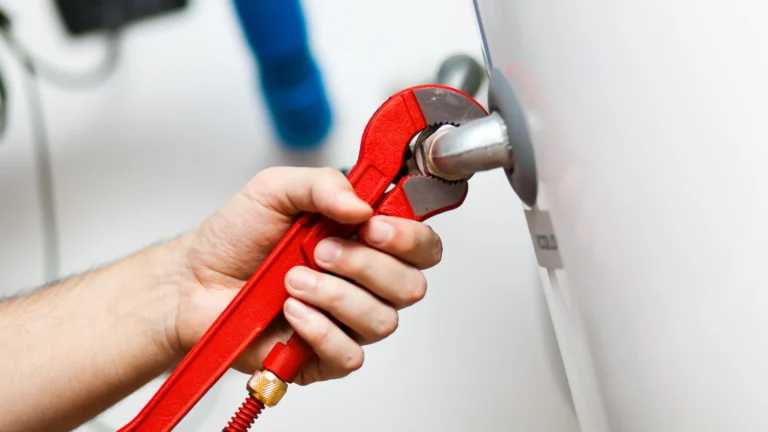 Technician repairing an hot-water heater